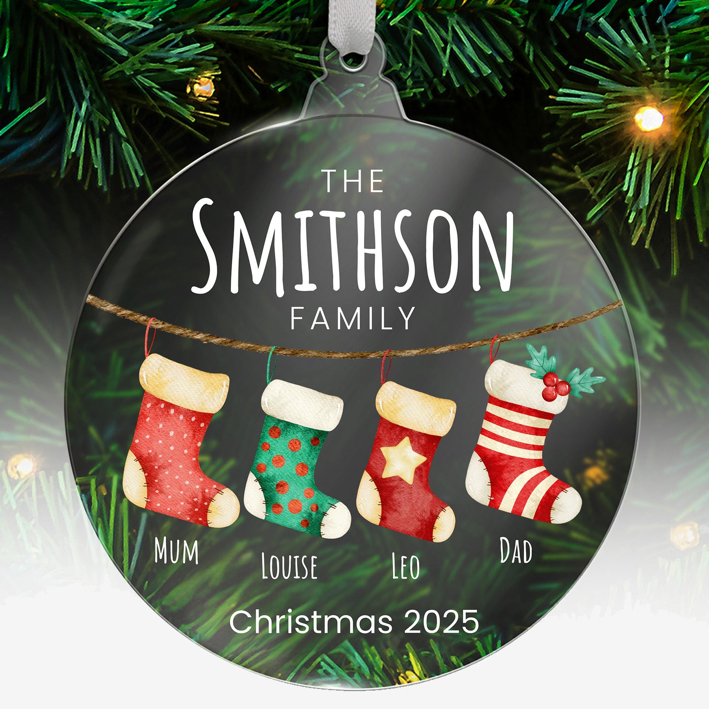 Personalised Christmas acrylic bauble with stockings and family names  hanging on a tree