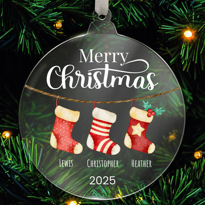 Personalised Christmas acrylic bauble with stockings and family names  hanging on a tree