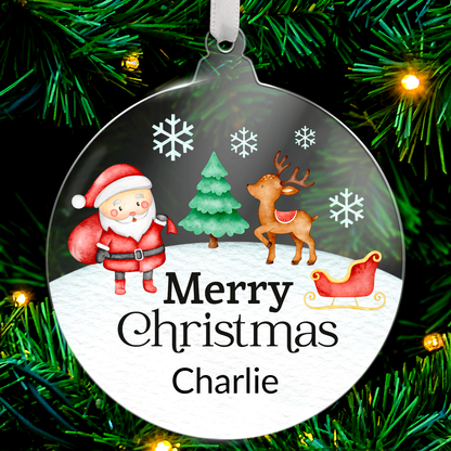 Round acrylic Christmas tree ornament with illustrations of Santa Claus, Christmas Tree, Reindeer, and a sleigh, featuring the message 'Merry Christmas' and space for custom text below.
