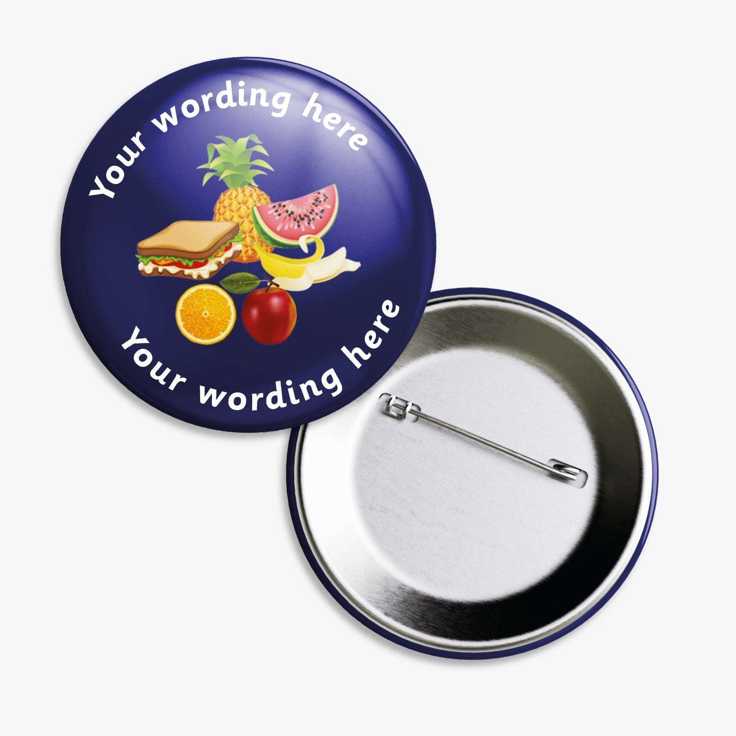 Set of ten 50mm round badges with a dark blue background, featuring a central illustration of a sandwich, pineapple, watermelon slice, orange, and apple; customisable text areas are positioned above and below the image, and the badge includes a safety pin backing.
