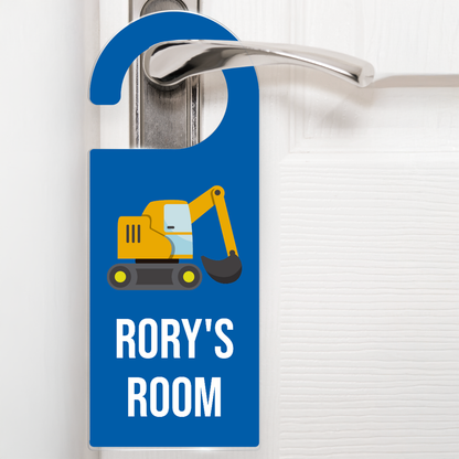 A deep blue door hanger hanging on a silver handle, featuring a cartoon yellow digger above the text 'Rory's Room' in white letters. The design is playful and child-friendly, ideal for decorating a child's bedroom door.