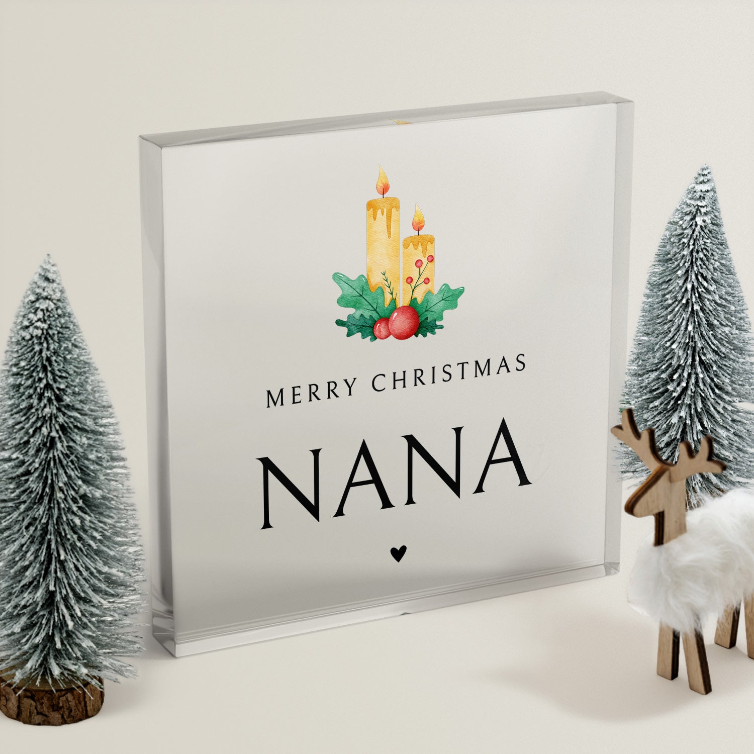 Framed Christmas acrylic block with 'Merry Christmas Nana' text, candles, and trees on a light background.
