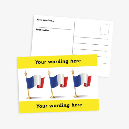 A6-sized personalised postcard featuring three French flags on gold poles against a white background, with customisable text areas above and below the flags in yellow bands; reverse side includes space for a handwritten message and recipient address—ideal for engaging pupils in French language or cultural activities.
