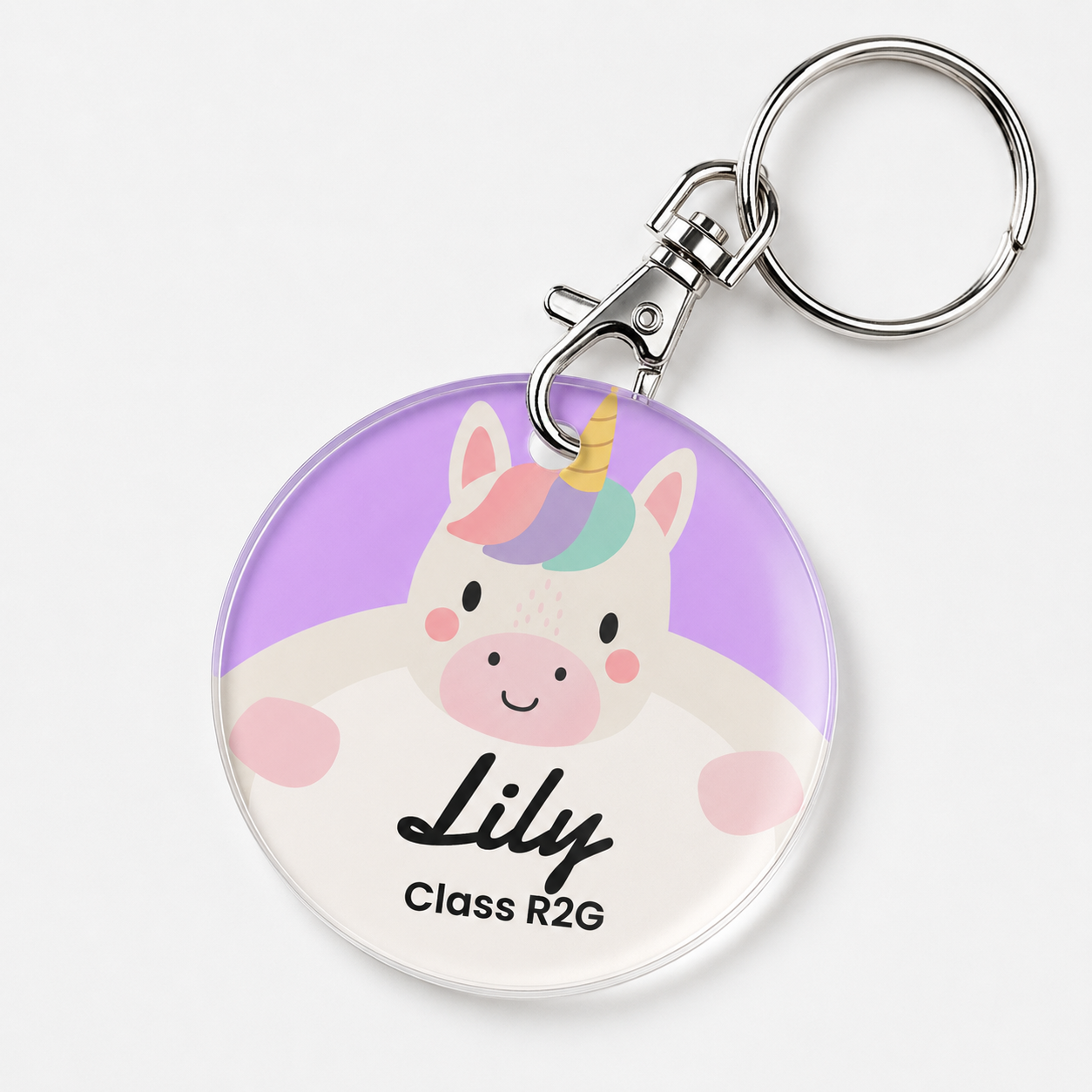 A personalized acrylic bag tag featuring a unicorn and example text 'Lily Class R2G'. 