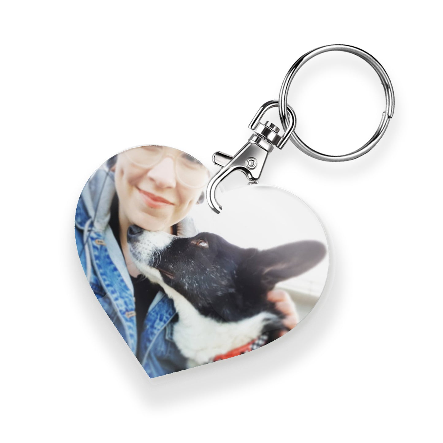 A personalised keyring featuring a heart photo frame design with a metal keychain and clasp. The photo shows a person with a dog 