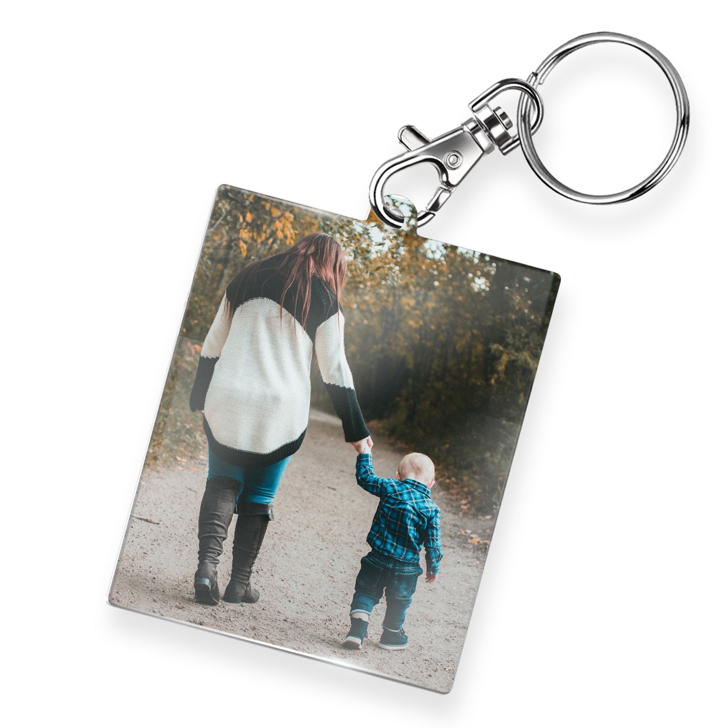 A personalised keyring featuring a rectangular photo frame design with a metal keychain and clasp. The photo shows an adult walking holding a toddlers hand. 