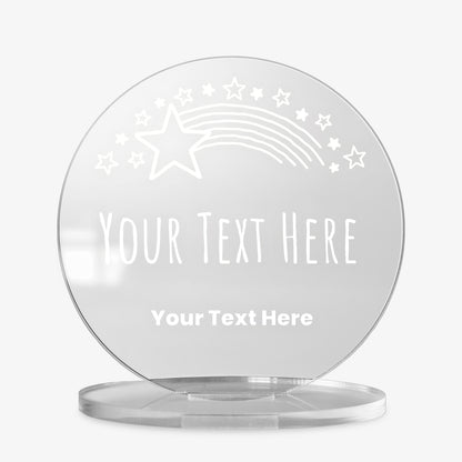 Clear round acrylic award with customisable text, featuring a shooting star and star motif design, displayed against a white background.