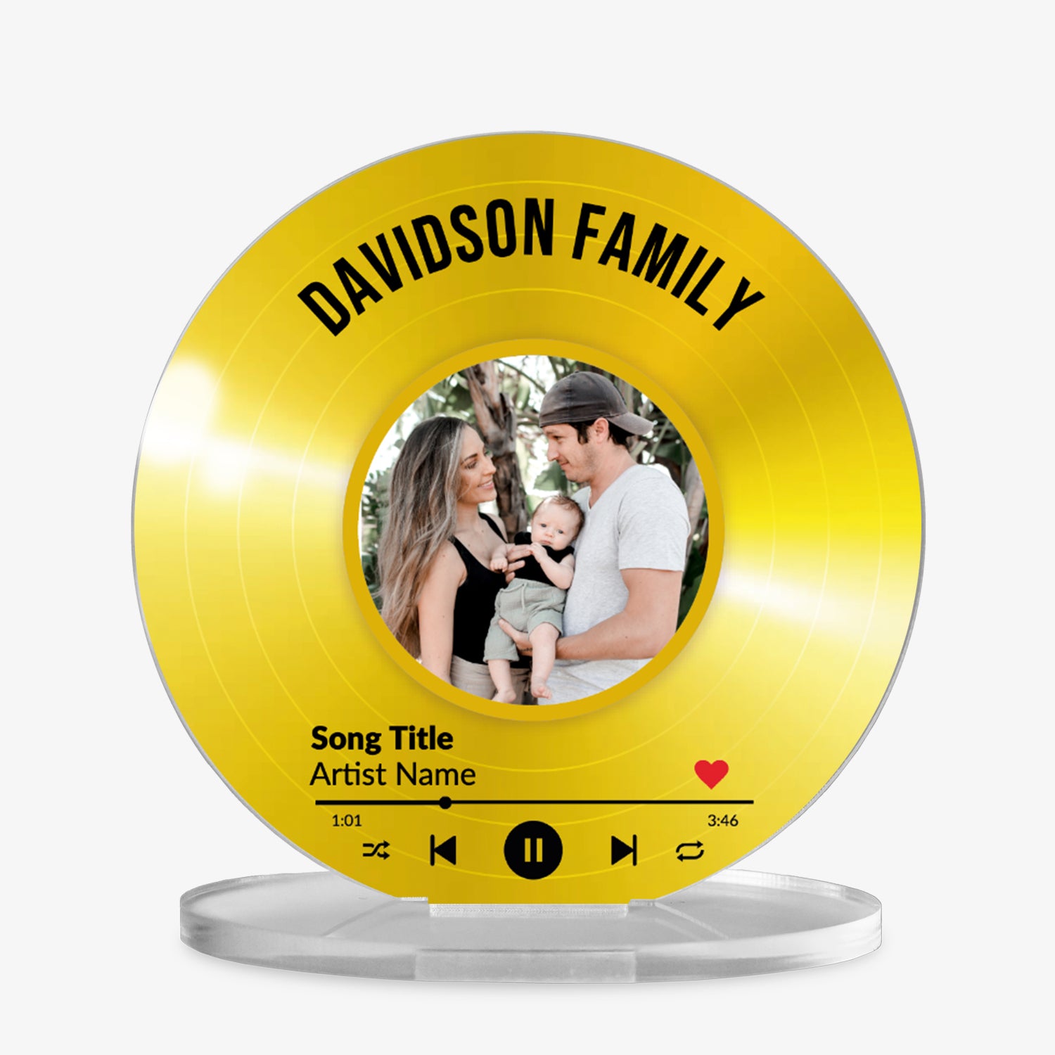 Acrylic custom vinyl record-style display with a gold background with a circular photo in the centre, personalised text 'Davidson Family' at the top, and a mock music player interface showing song title and artist name at the bottom.