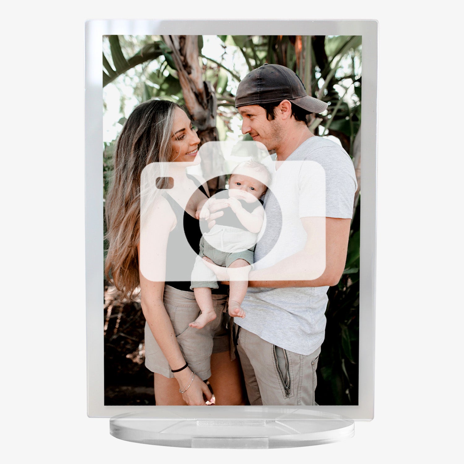 A personalised acrylic photo plaque with a clear stand. The plaque features a full scal photo of a family with their baby. The design has a clear border surrounding the image..