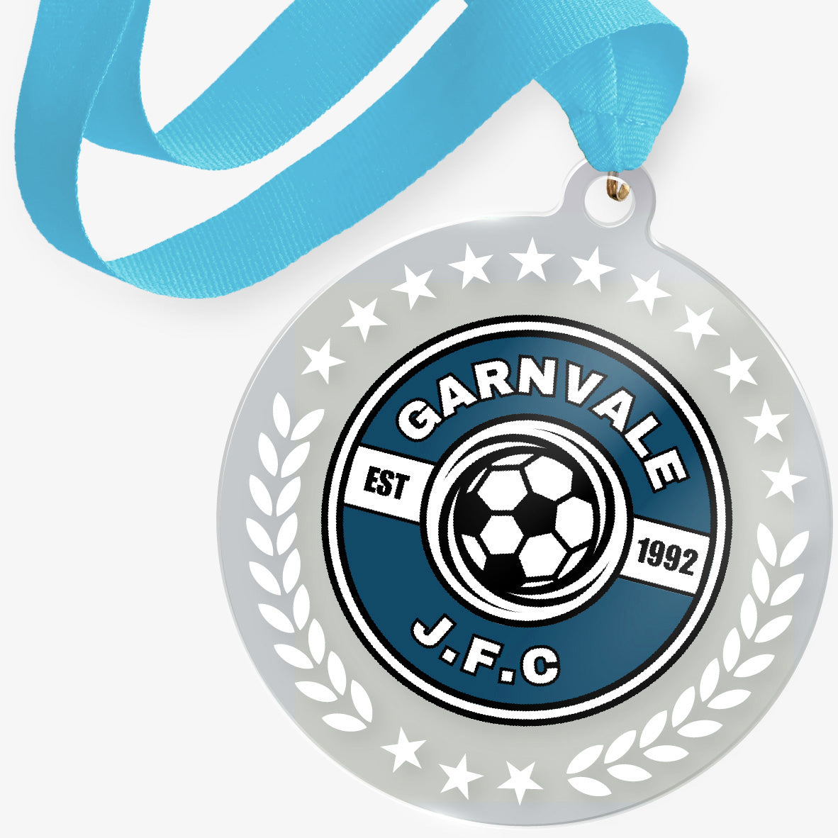 Medal with 'Garnvale J.F.C.' logo and blue ribbon on a white background