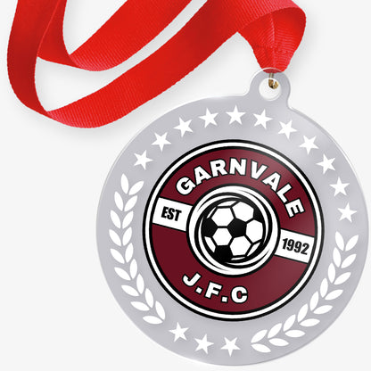 Acrylic medal with 'Garnvale J.F.C' logo and red ribbon on a white background