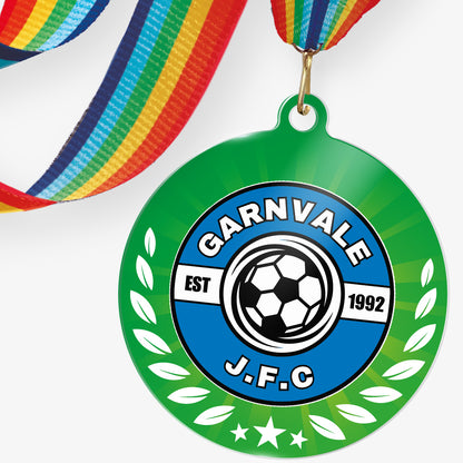 Acrylic personalised medal with rainbow ribbon showing green background with wreath design and 'Garnvale JFC' logo.