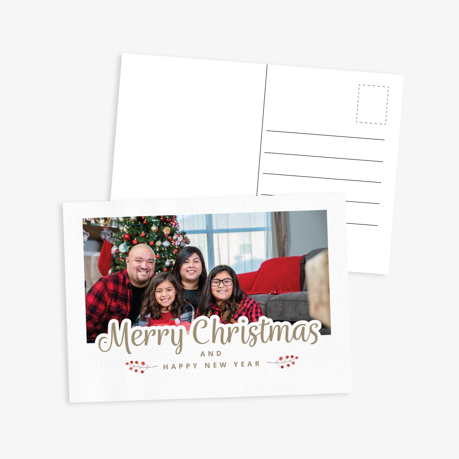 Front and back of a festive Christmas postcard. The front features the text 'Merry Christmas and Happy New Year' and space to upload own photo - the image shows a family in front of a christmas tree. The back includes standard postcard lines for address and message