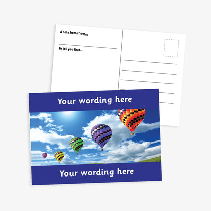 Personalised A6 Hot Air Balloon Postcard, featuring a cyan border framing a sky scene with multiple colourful hot air balloons floating among clouds. The front side includes the placeholder text 'Your wording here!' in bold white letters, allowing for customisation. The reverse side displays a standard postcard layout with space for a message and address.