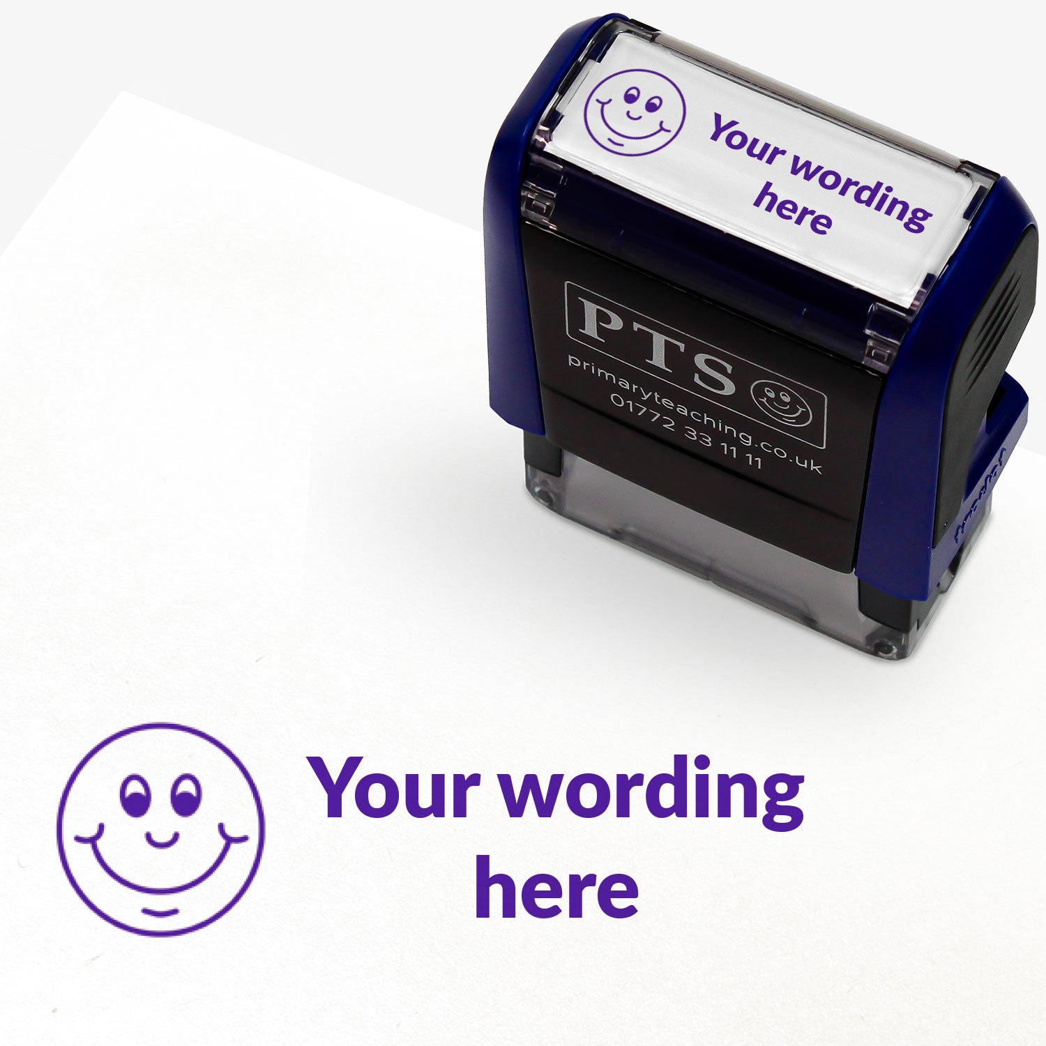 Rectangular self-inking stamper measuring 38mm by 15mm, featuring the phrase 'Your wording here' next to a smiling emoji face in purple ink.