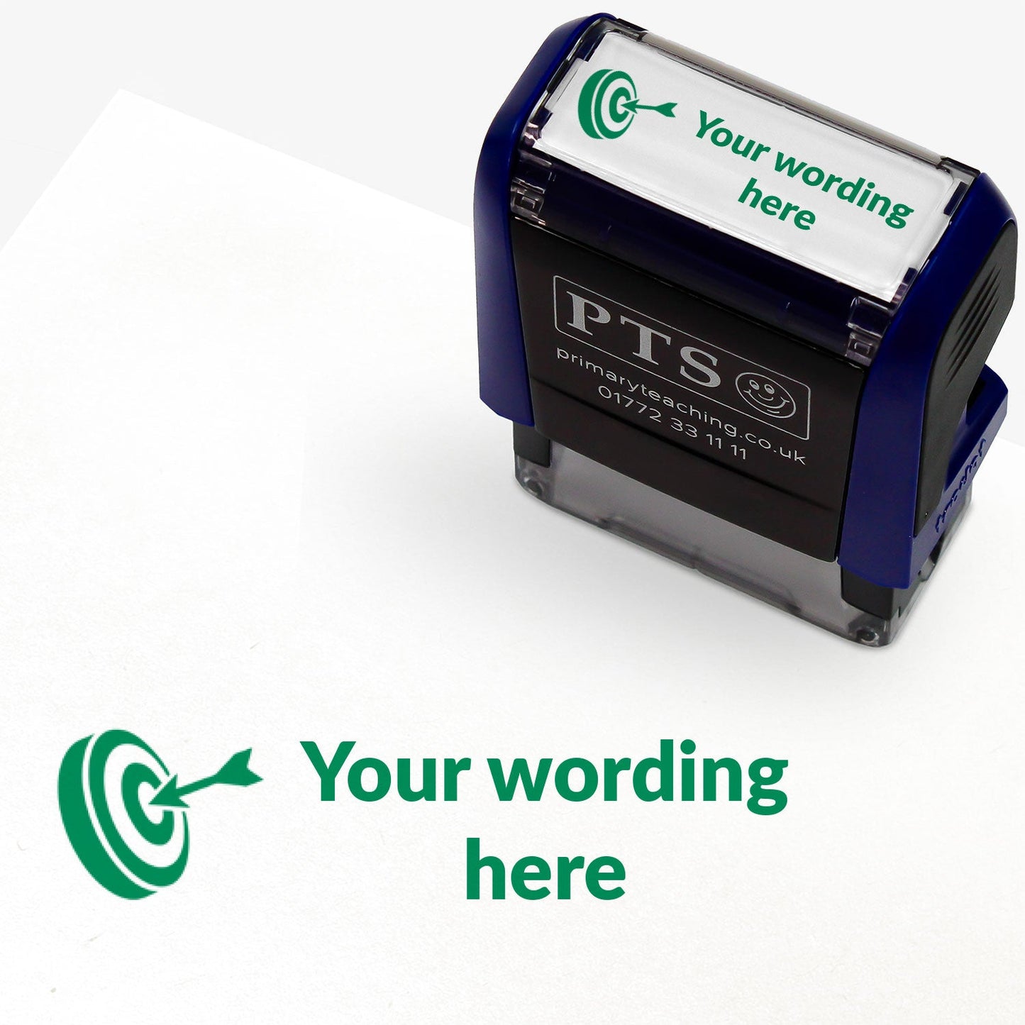 Rectangular self-inking stamper measuring 38mm by 15mm, featuring the phrase 'Your wording here' next to a target with an arrow in it in green ink.