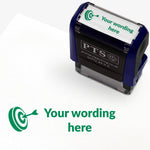 Rectangular self-inking stamper measuring 38mm by 15mm, featuring the phrase 'Your wording here' next to a target with an arrow in it in green ink.