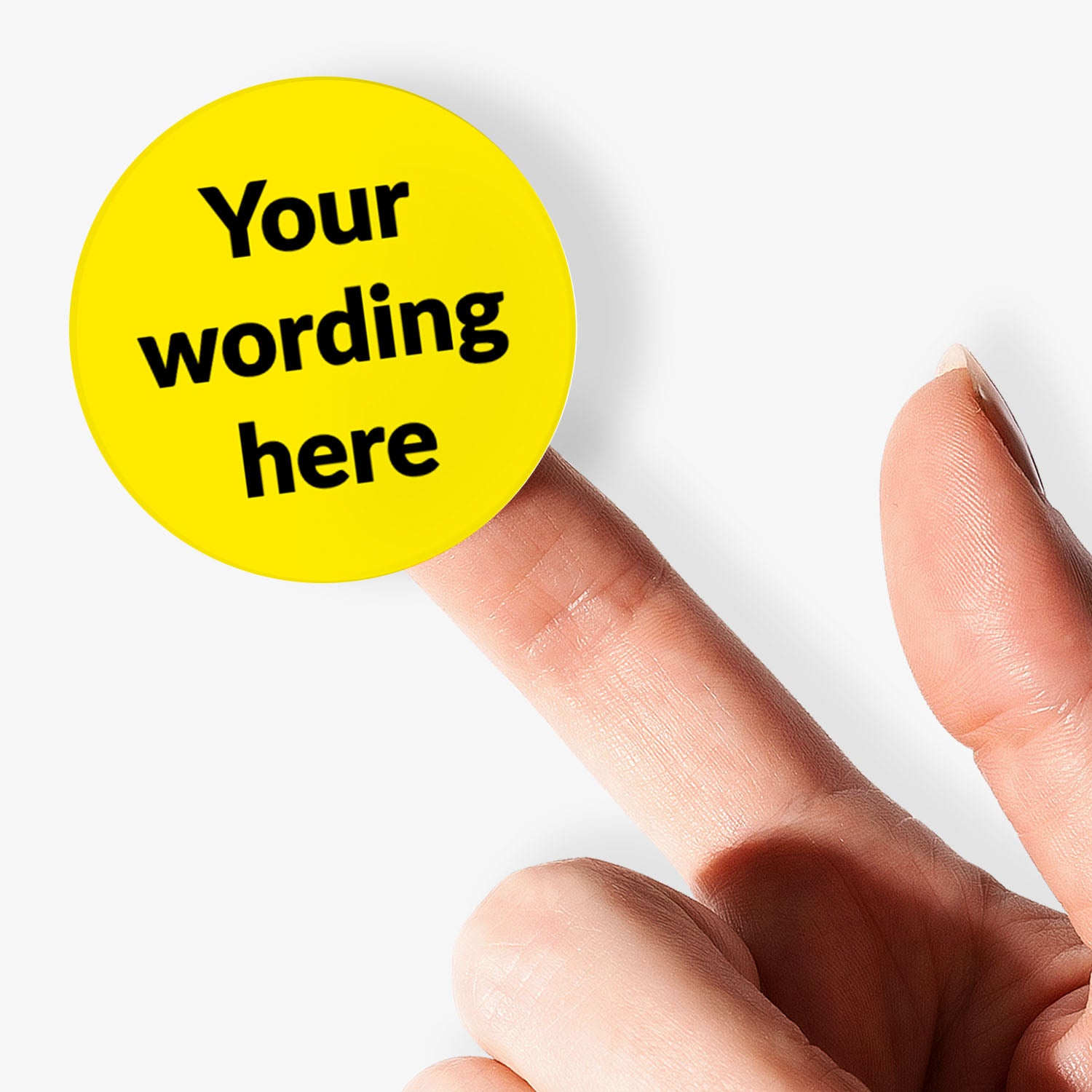 Yellow sticker with 'Your wording here' text held by hand on a white background.