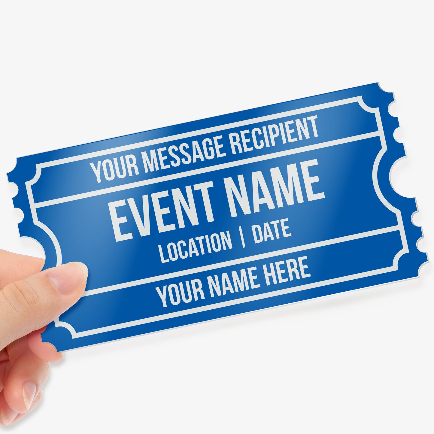Hand holding a blue acrylic event ticket with customisable text fields, including 'Your Message Recipient', 'Event Name', 'Location | Date', and 'Your Name Here', designed with a classic ticket border style.