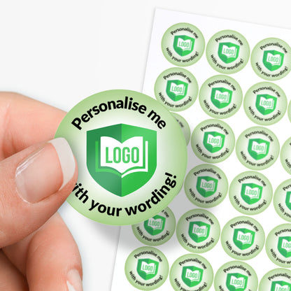 Green round sticker with 'Personalise me with your wording!' text held by a hand, surrounded by more stickers on a white background.