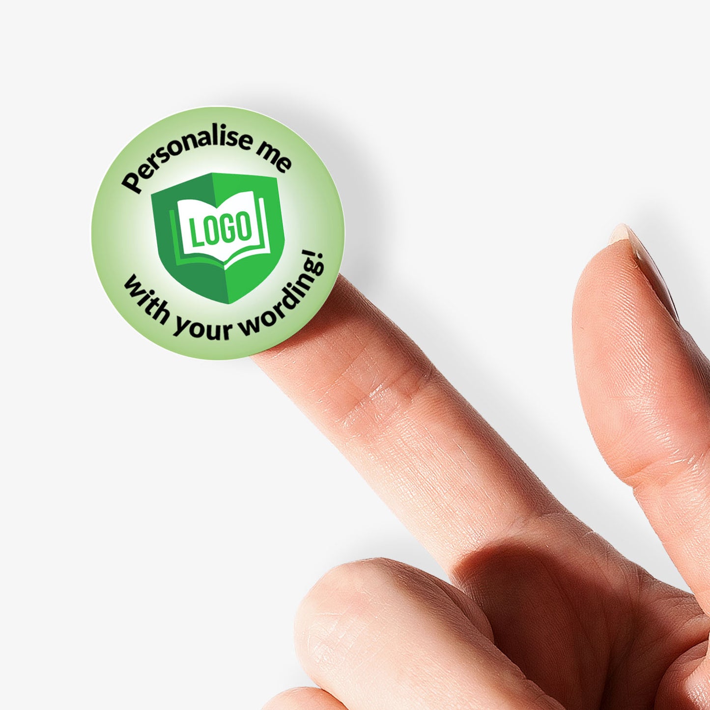 Green button with 'Personalise me' text held between fingers on a white background