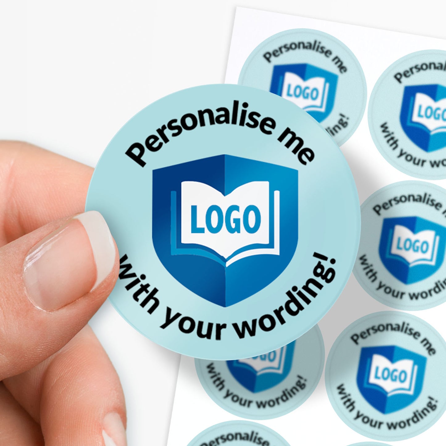 Round customisable sticker with text 'Personalise me with your wording!' held by a hand.