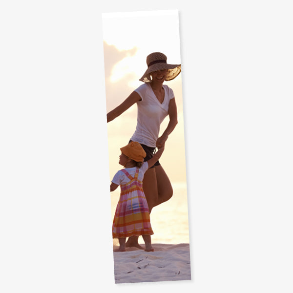Card, portrait bookmark showing a photo of a mother dancing on the beach with her toddler.