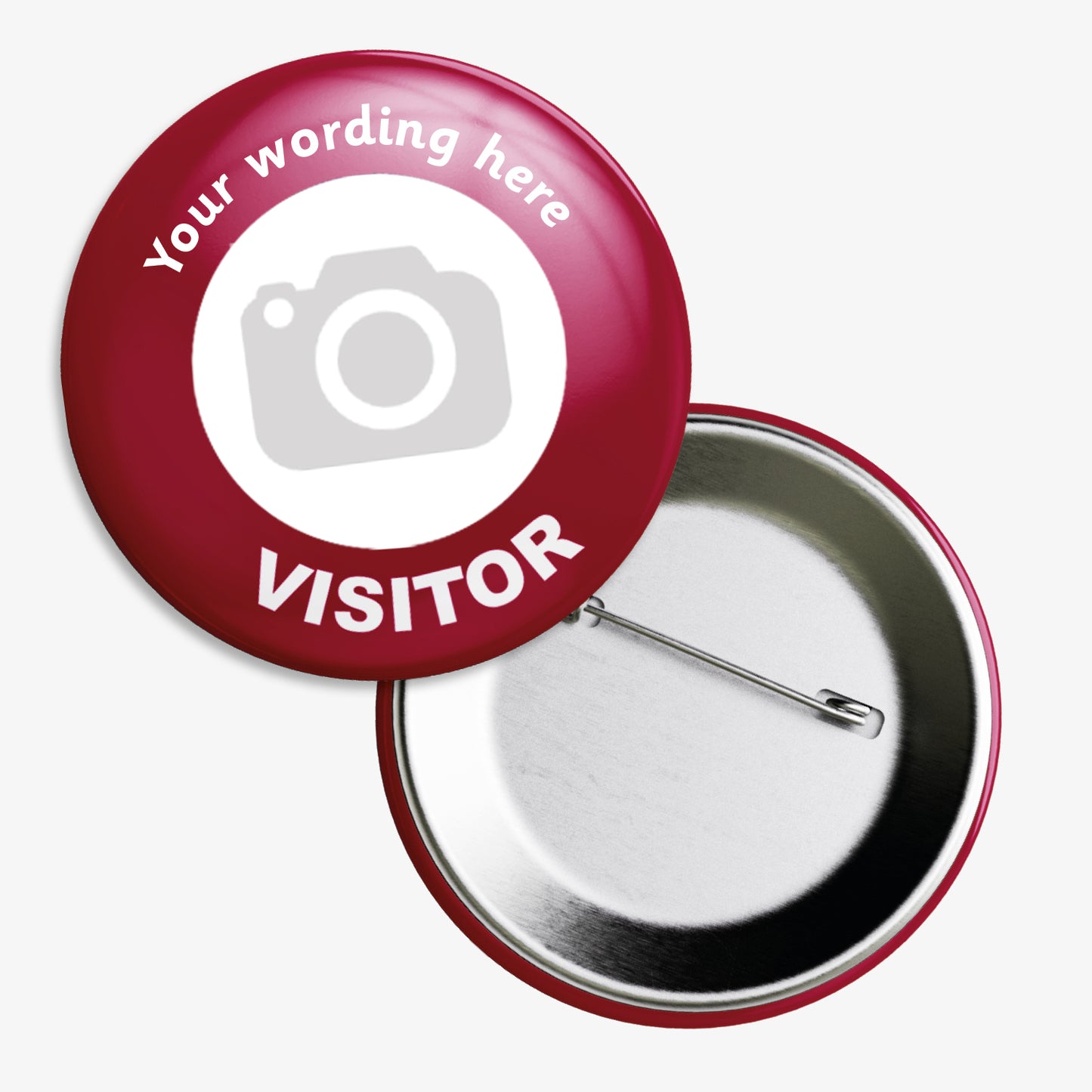 A set of ten 50mm round metal visitor badges with a red border and white centre, displaying the placeholder text 'Your wording here' above a camera icon, and the word 'VISITOR' in bold white letters; designed for customisation with uploaded images and text, ideal for schools and educational settings