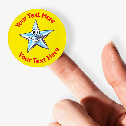 Yellow sticker, on a finger, with a silver smiling star as the central image.  Space for personalisation above and below the image.