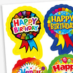 Sheet of colourful birthday stickers featuring rosette-style designs with bold 'Happy Birthday' text. Each sticker includes bright patterns and ribbon elements in various colours such as yellow, blue, red, and rainbow themes.