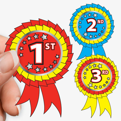 Colorful award ribbons for 1st, 2nd, and 3rd place held by a hand.