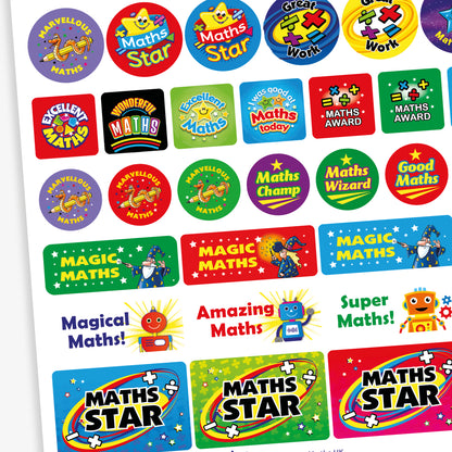 A collection of colourful maths-themed reward stickers with phrases such as 'Maths Award', 'Magical Maths', 'Cool Maths', 'Marvellous Maths', 'Maths Star', and 'Great Work'. Designs feature fun characters and imagery like trophies, magicians' hats, rabbits, penguins, and smiling number-themed creatures. The stickers come in various bright colours and shapes, designed to celebrate and motivate achievement in mathematics.