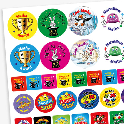 A collection of colourful maths-themed reward stickers with phrases such as 'Maths Award', 'Magical Maths', 'Cool Maths', 'Marvellous Maths', 'Maths Star', and 'Great Work'. Designs feature fun characters and imagery like trophies, magicians' hats, rabbits, penguins, and smiling number-themed creatures. The stickers come in various bright colours and shapes, designed to celebrate and motivate achievement in mathematics.