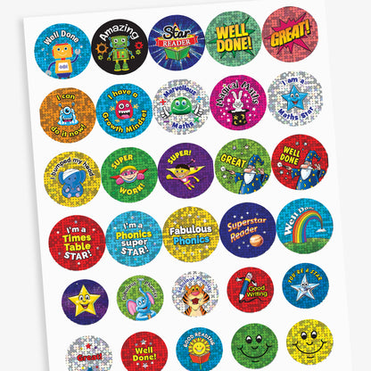 Overview of a sheet of colourful reward stickers featuring a variety of fun designs including robots, wizards, rainbows, books, and stars. Messages include 'Well Done', 'Amazing', 'Magical Maths', 'Star Reader', 'Superstar Reader', and 'I'm a Phonics Super Star'.