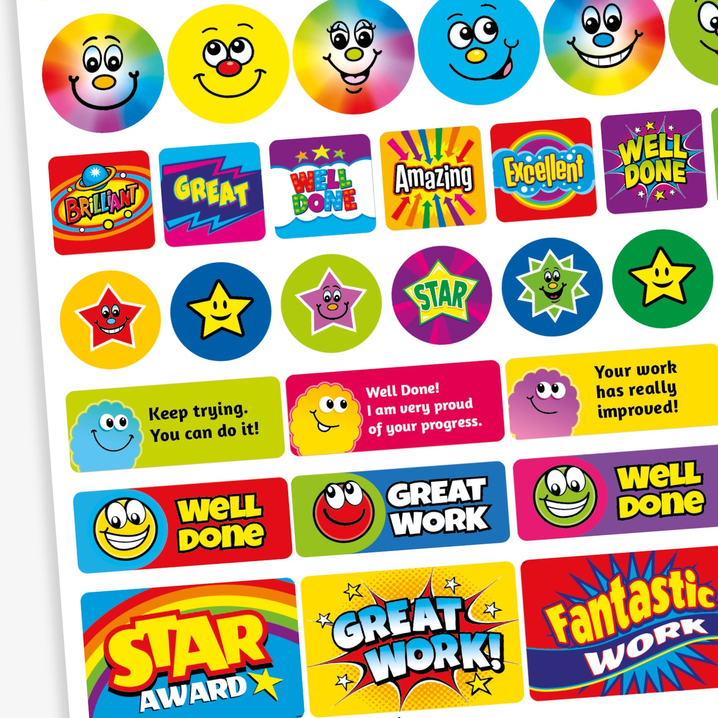 A mixed sheet of colourful reward stickers with phrases such as 'Well Done', 'Star Award', 'Amazing', and 'Excellent'. The stickers feature bold text in vibrant colours and various styles, including round and rectangular shapes. Some designs include smiley faces, stars, and rainbow effects, all intended to celebrate effort and achievement in a fun, eye-catching way.