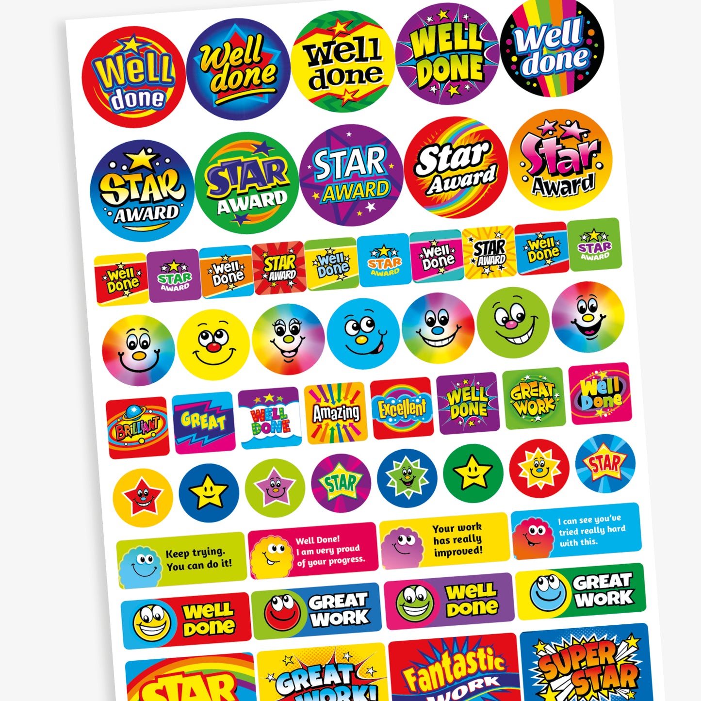 A mixed sheet of colourful reward stickers with phrases such as 'Well Done', 'Star Award', 'Amazing', and 'Excellent'. The stickers feature bold text in vibrant colours and various styles, including round and rectangular shapes. Some designs include smiley faces, stars, and rainbow effects, all intended to celebrate effort and achievement in a fun, eye-catching way.