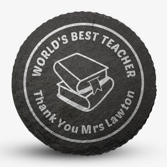 Round black slate drinks coaster with engraved placeholder text reading 'WORLD'S BEST TEACHER', Thank You Mrs Lawton', image of two text books stacked on each other, designed for personalisation.