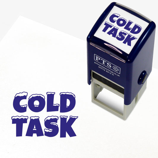 25mm self-inking stamper with blue ink.  The stamp impression is the phrase 'COLD TASK' with snow capping each letter.