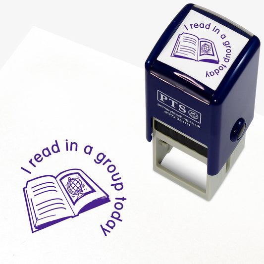 25mm self-inking stamper with purple ink, featuring the phrase 'I read in a group today' in a curved font above an open book illustration with a globe; ideal for marking pupils' reading records.