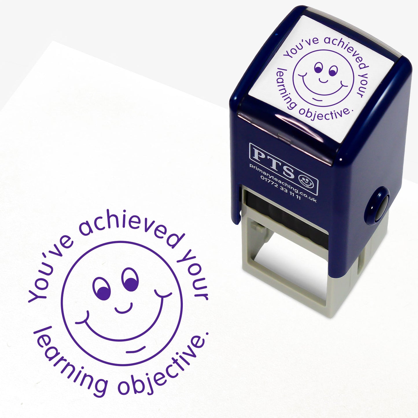 Purple 25mm pre-inked stamper featuring a smiling face surrounded by the phrase 'You've achieved your learning objective'.