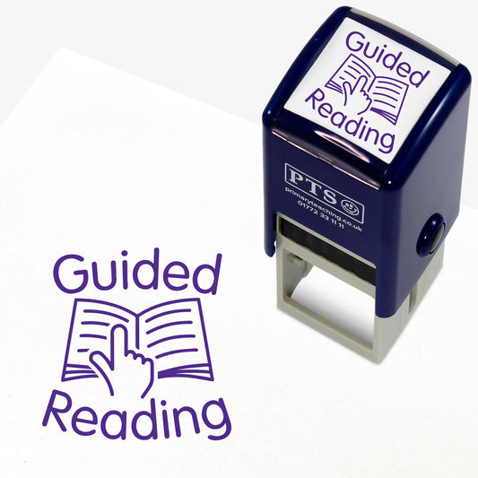 A 25mm round pre-inked teacher stamper with purple ink, featuring an illustration a finger following text on an open booke, around which is the phrase 'Guided Reading'.
