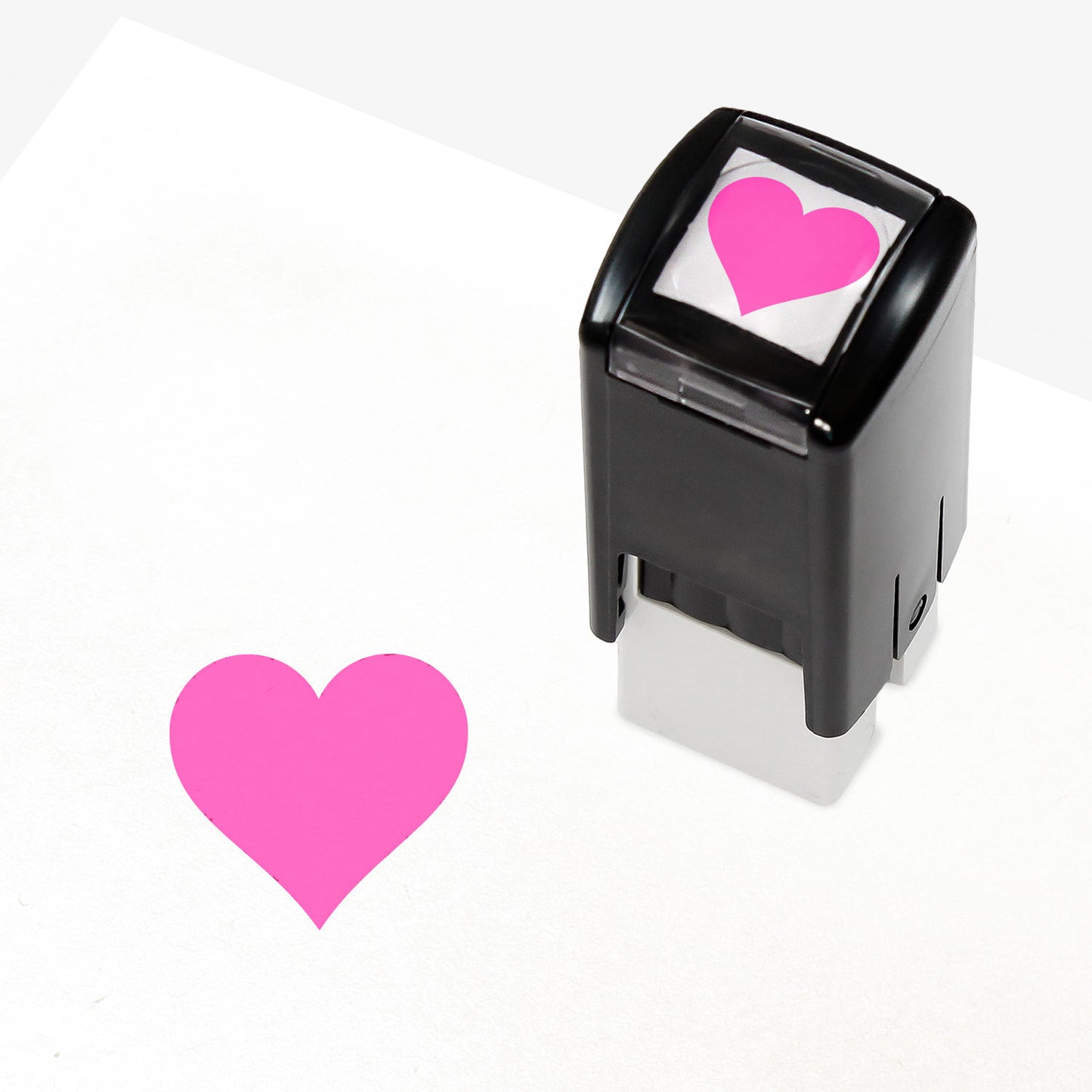 A 10mm self-inking stamp with a solid pink heart central to the design
