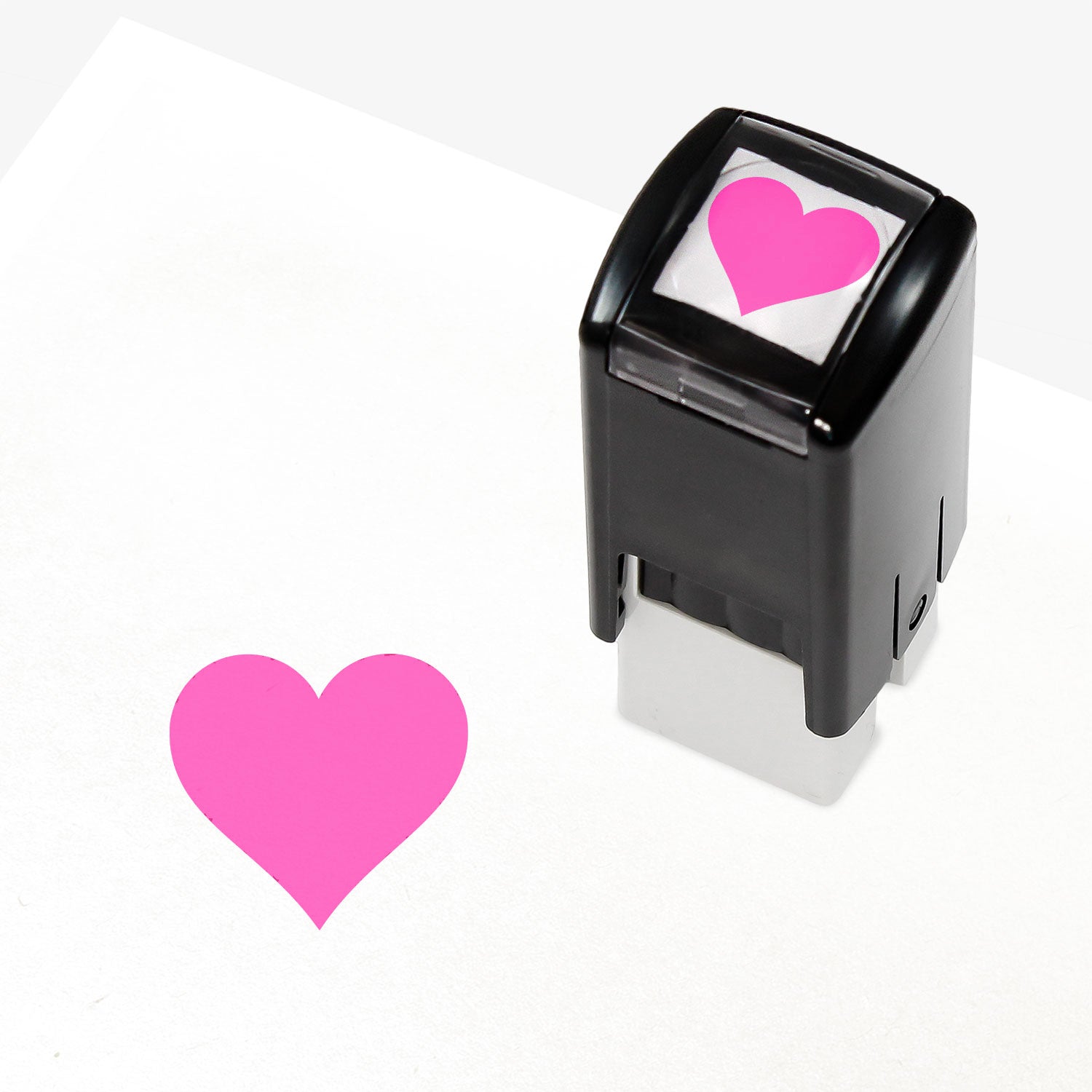 A 10mm self-inking stamp with a solid pink heart central to the design