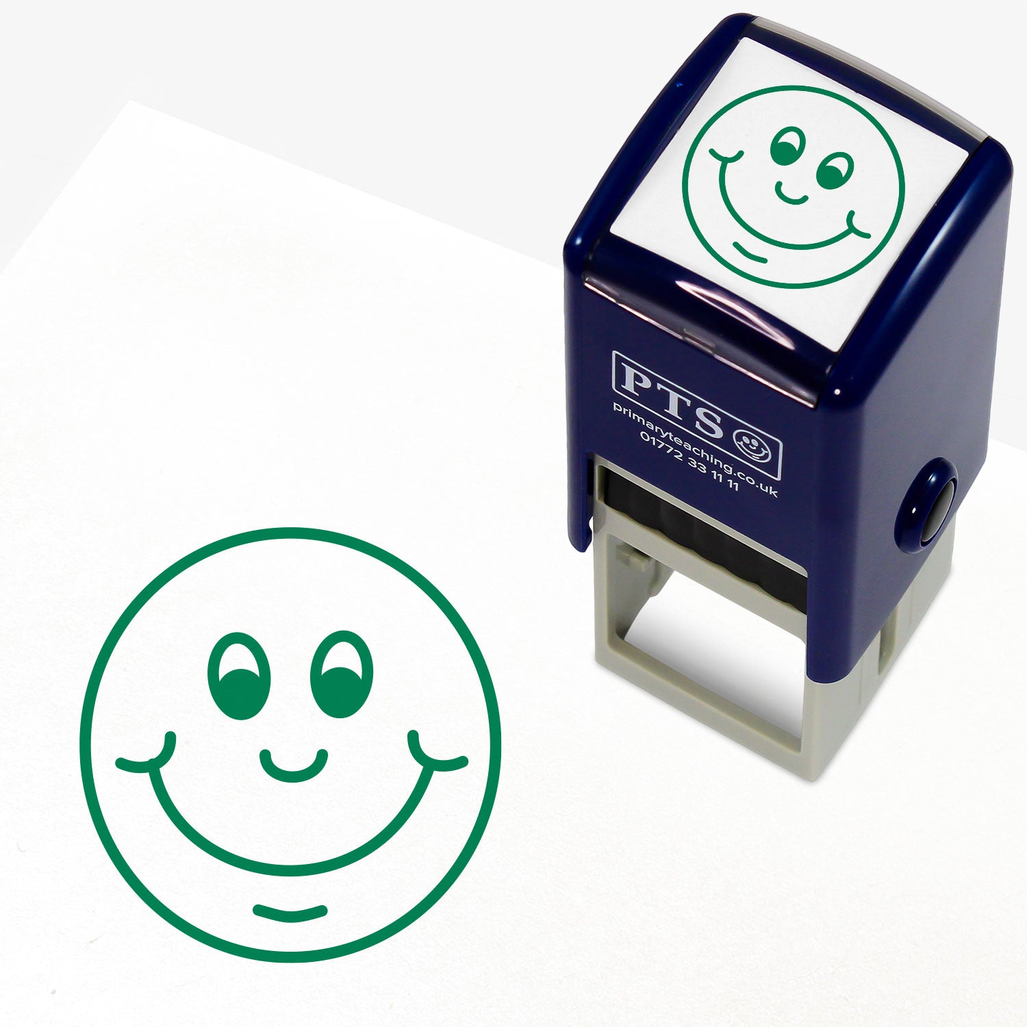 Green 25mm pre-inked stamper featuring a cheerful smiley face design, with customisable text above and below the image, ideal for classroom marking and pupil encouragement.