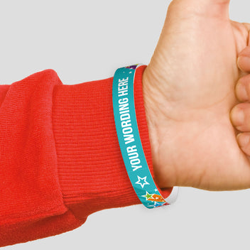 Customizable wristband on a wrist with a red sleeve.