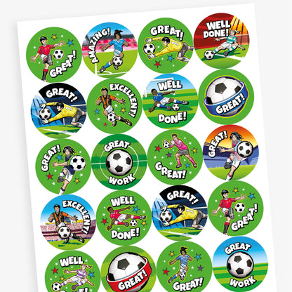 Sheet of 32mm circular stickers featuring graphics of female and male footballers including kicking a fooball to score a goal and a goalkeeper saving a goal, alongside central football images.  Phrases include 'WELL DONE', 'GREAT' and 'AMAZING'