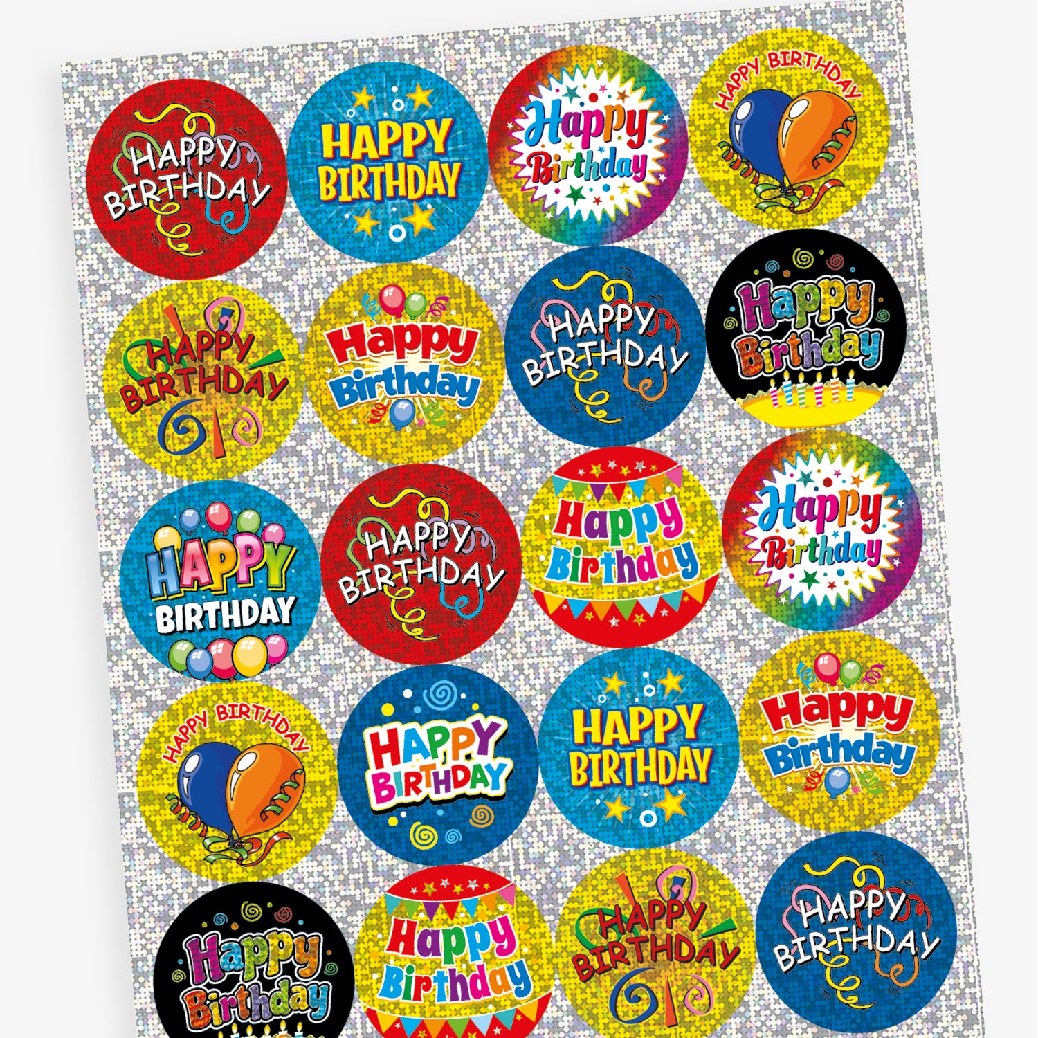 A sheet of colourful, holographic circular 'Happy Birthday' stickers with celebratory designs. Each sticker features bright backgrounds in blue, yellow, and red, decorated with confetti, balloons, and streamers, with bold 'Happy Birthday' text in various styles.