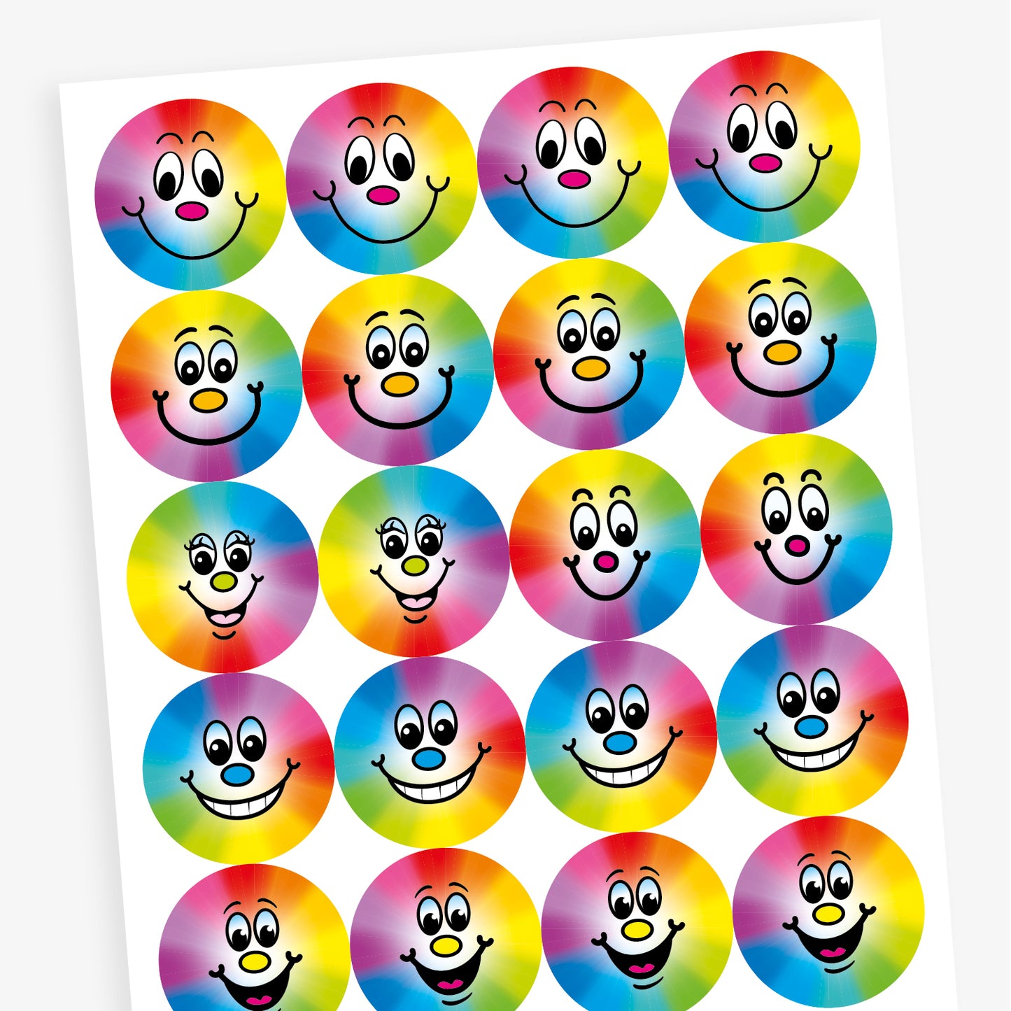 A sheet of stickers with a rainbow spectrum background with a smiling face central to the design.