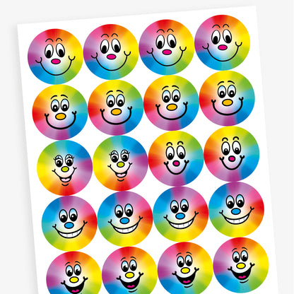 A sheet of stickers with a rainbow spectrum background with a smiling face central to the design.