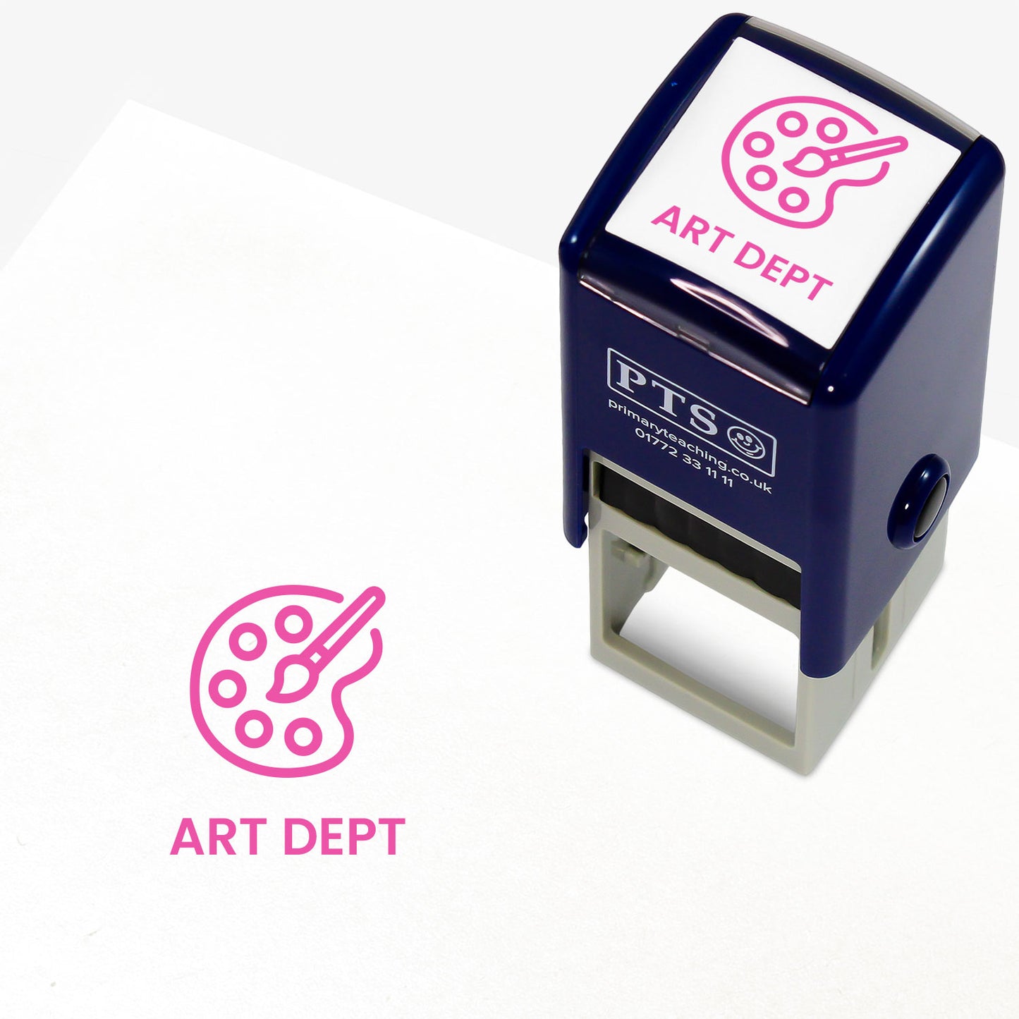 A stamper shown next to a sample stamped image on a white background. The stamp has a pink outline of a painting pallette inside a shield shape, with placeholder text 'ART DEPT' on the top panel and below the stamp print.